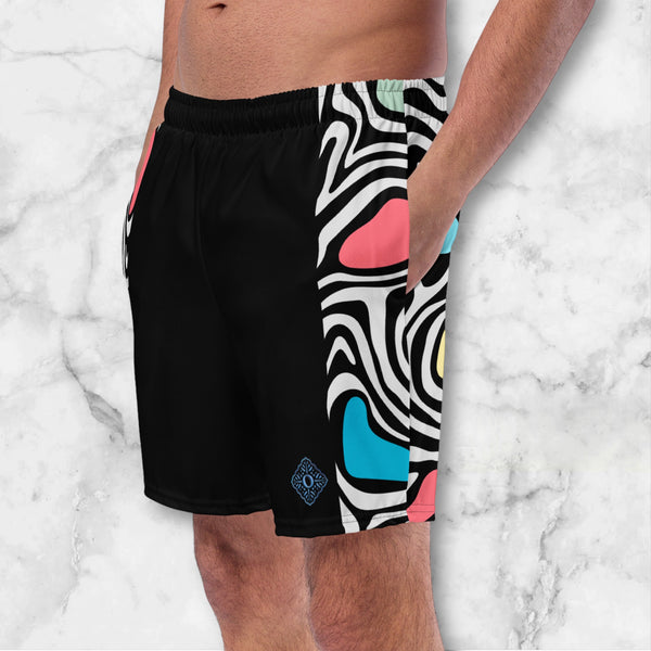 Aurora daze mens swimshorts swimtrunks for men oumaima swim recycled mens boardshorts abract colorful print digital print, seen with hands in pockets from the side