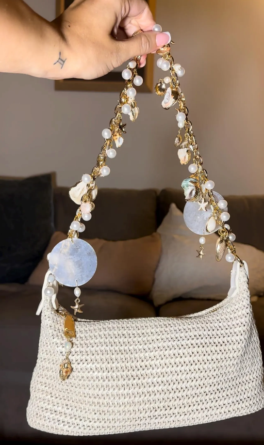Gold chain handbag with pearls and shells charms sparkling beach bag for evenings and the beach, seen full size hanging
