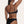  Amour black bikini Bottoms in Onyx with a gold ring, Sustainable recycled swimwear luxury bikini, seen on a model from the back raising one arm holding her hair